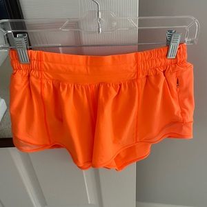 Highlighter orange lululemon hotty hot shorts